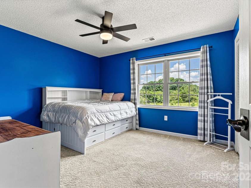 1310 Maple Lee Court, Crouse, NC 28033.  MLS# CAR4278715, YatesRealty ID 27296. 2nd Bedroom on upper level provides a gorgeous view of the pool!  Includes updated fan/lighting.