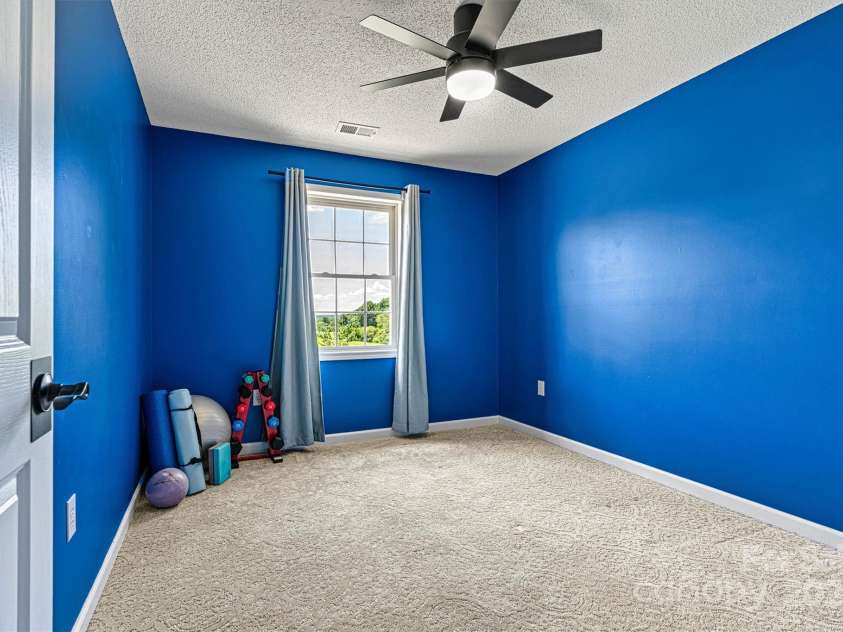 1310 Maple Lee Court, Crouse, NC 28033.  MLS# CAR4278715, YatesRealty ID 27296. Bedroom 4 on the upper level with updated fan/lighting.
