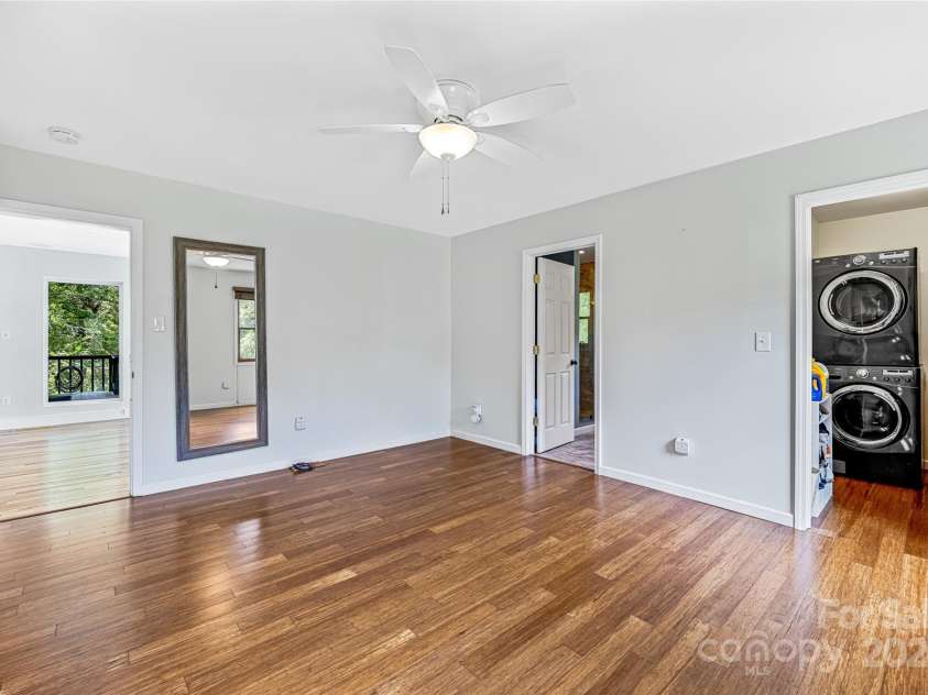 48 Merrell Road, Leicester, NC 28748.  MLS# CAR4172323, YatesRealty ID 2730. Laundry in Primary closet