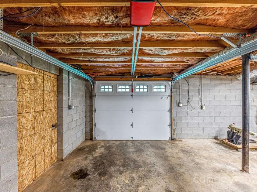 48 Merrell Road, Leicester, NC 28748.  MLS# CAR4172323, YatesRealty ID 2730. Lower Garage - Workshop