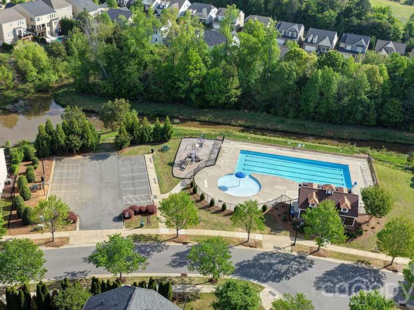 148 Byers Commons Drive, Mooresville, NC 28117.  MLS# CAR4368080, YatesRealty ID 27301. Aerial perspective highlighting the community’s amenities