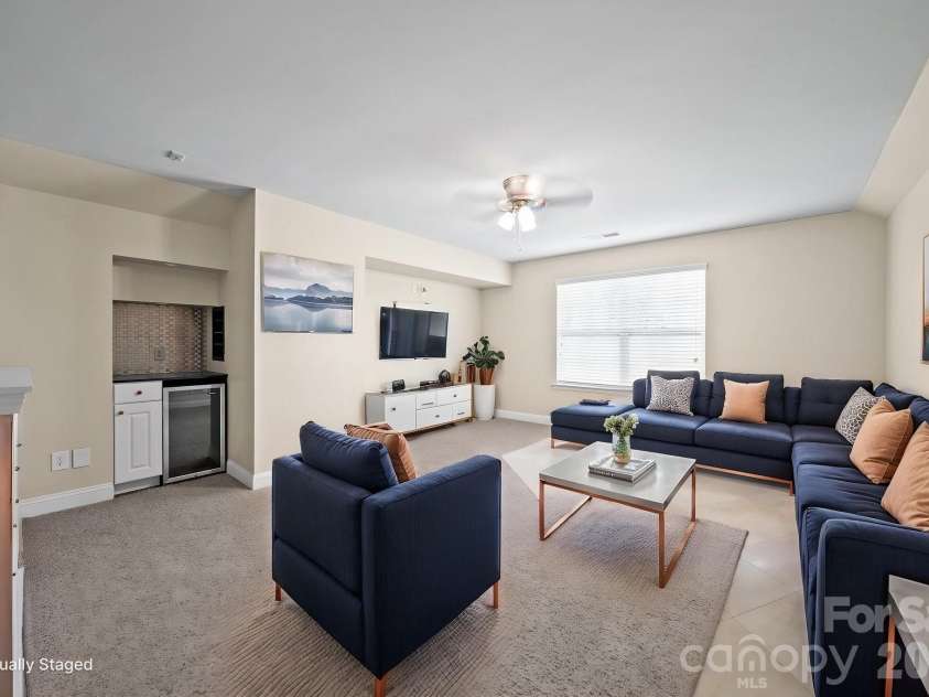 148 Byers Commons Drive, Mooresville, NC 28117.  MLS# CAR4368080, YatesRealty ID 27301. Flex room is virtually staged to showcase its possibilities and highlight the spacious layout.