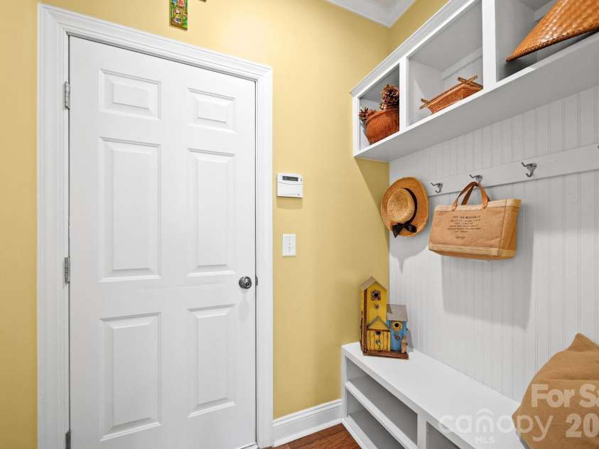 148 Byers Commons Drive, Mooresville, NC 28117.  MLS# CAR4368080, YatesRealty ID 27301. Mudroom featuring built in storage and hanging space for convenient organization, with convenient access to the garage.