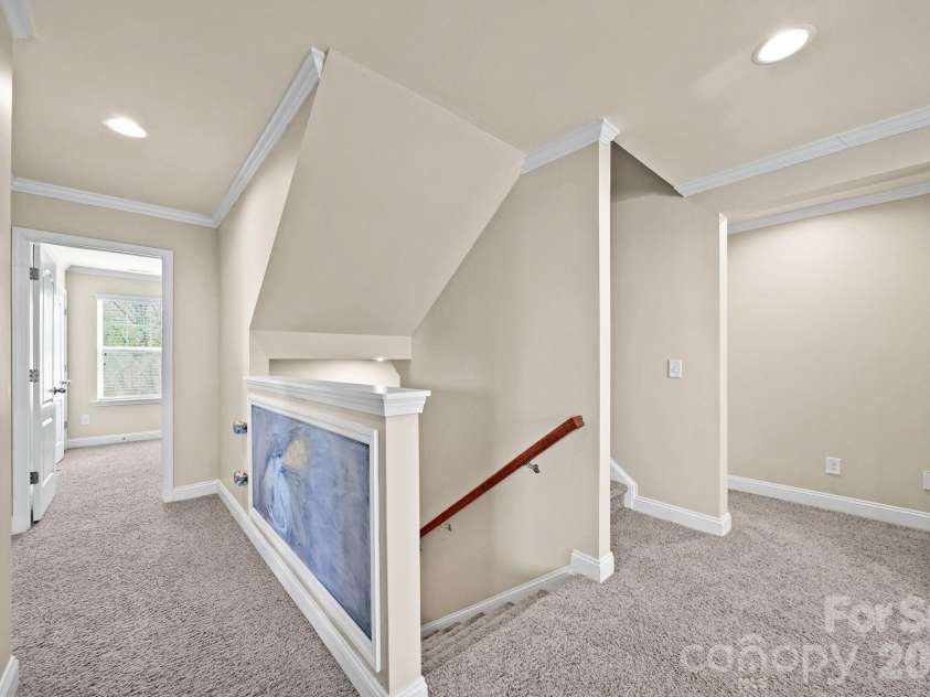 148 Byers Commons Drive, Mooresville, NC 28117.  MLS# CAR4368080, YatesRealty ID 27301. Step upstairs into a bright, oversized loft.  Notice chalkboard wall for creative minds.
