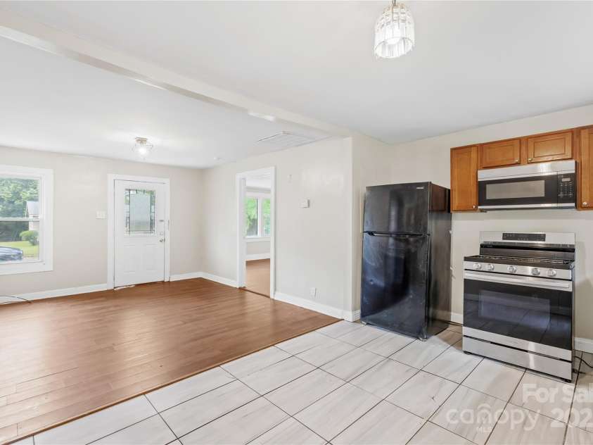 716 Wilson Road, Salisbury, NC 28144.  MLS# CAR4278566, YatesRealty ID 27301. Kitchen + Door to Primary Suite