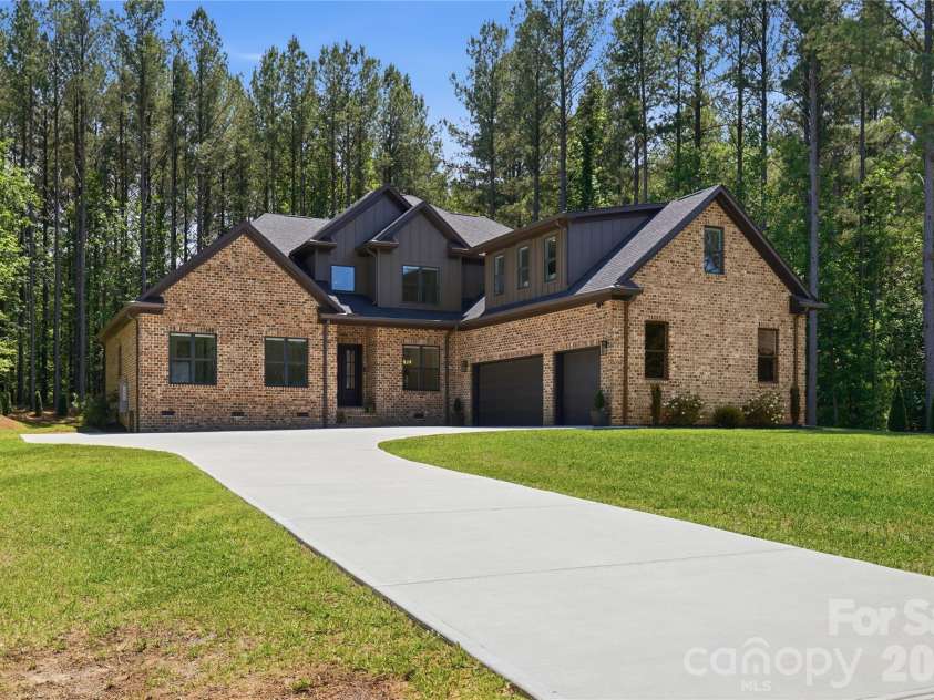 145 Crooked Branch Way, Troutman, NC 28166.  MLS# CAR4385546, YatesRealty ID 27315. Driveway