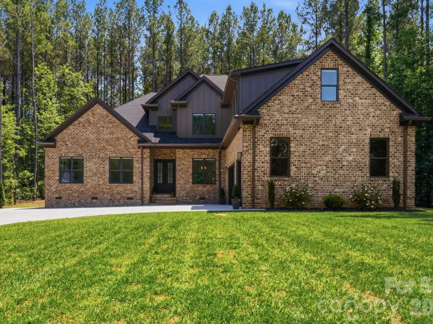 145 Crooked Branch Way, Troutman, NC 28166.  MLS# CAR4385546, YatesRealty ID 27315. Front Lawn