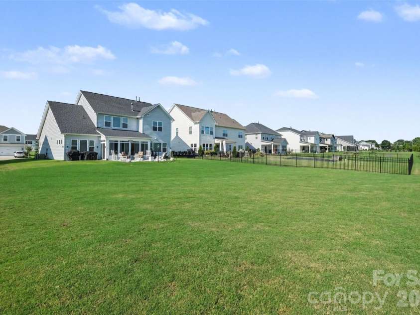 3826 Dahlia Drive, Harrisburg, NC 28075.  MLS# CAR4402406, YatesRealty ID 27316. Backyard