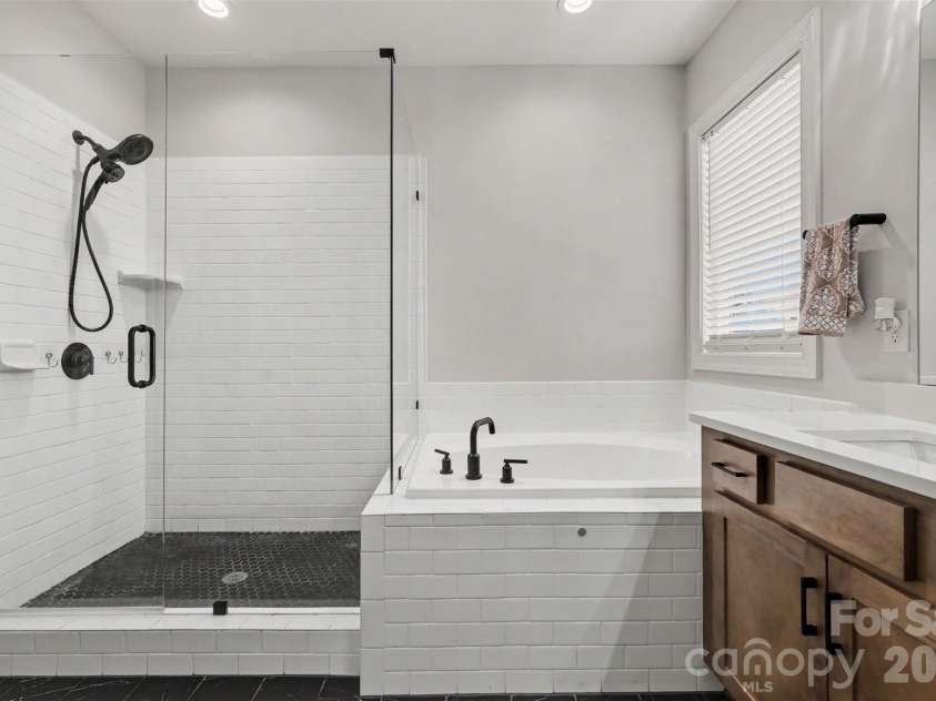 3826 Dahlia Drive, Harrisburg, NC 28075.  MLS# CAR4402406, YatesRealty ID 27316. Primary Bath Frameless showeer