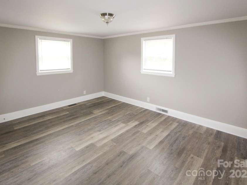1421 Thompson Avenue, Charlotte, NC 28216.  MLS# CAR4259124, YatesRealty ID 27317. Bedroom 1 master