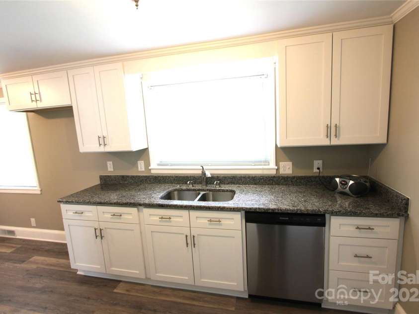 1421 Thompson Avenue, Charlotte, NC 28216.  MLS# CAR4259124, YatesRealty ID 27317. Granite tops, new cabinets, new  disposal, new dishwasher