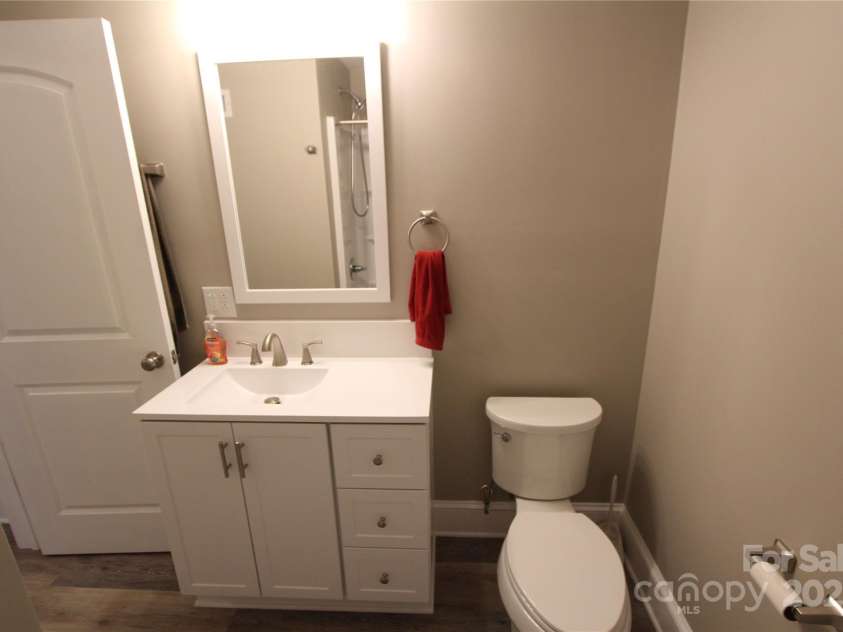 1421 Thompson Avenue, Charlotte, NC 28216.  MLS# CAR4259124, YatesRealty ID 27317. New bathroom cabinet, toilet