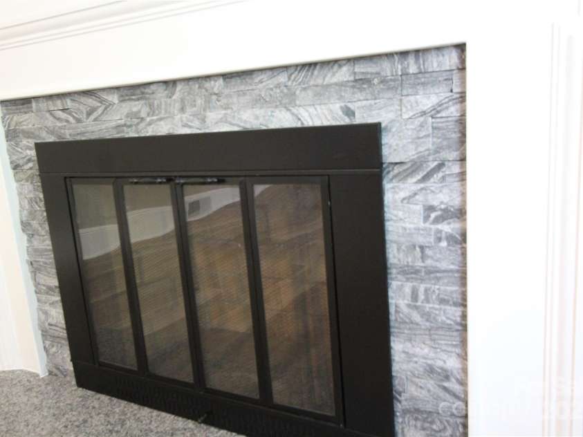 1421 Thompson Avenue, Charlotte, NC 28216.  MLS# CAR4259124, YatesRealty ID 27317. New stacked stone suround at fireplace opening