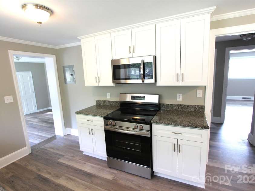 1421 Thompson Avenue, Charlotte, NC 28216.  MLS# CAR4259124, YatesRealty ID 27317. New stove and microwave