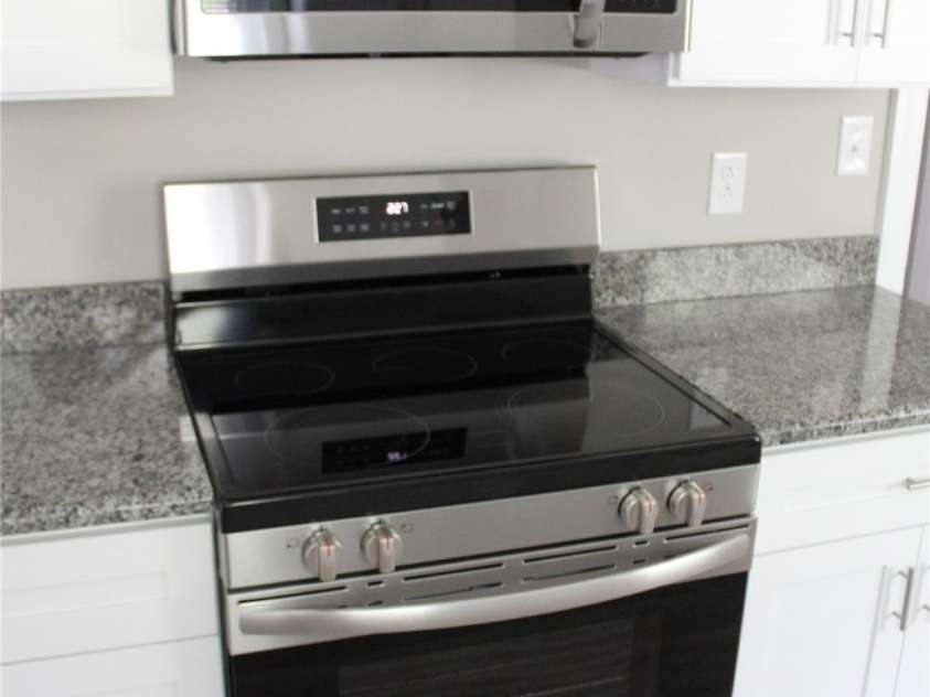 1421 Thompson Avenue, Charlotte, NC 28216.  MLS# CAR4259124, YatesRealty ID 27317. New stove and microwave