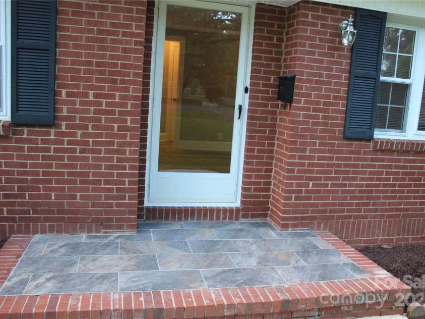 1421 Thompson Avenue, Charlotte, NC 28216.  MLS# CAR4259124, YatesRealty ID 27317. New tile at entrance door