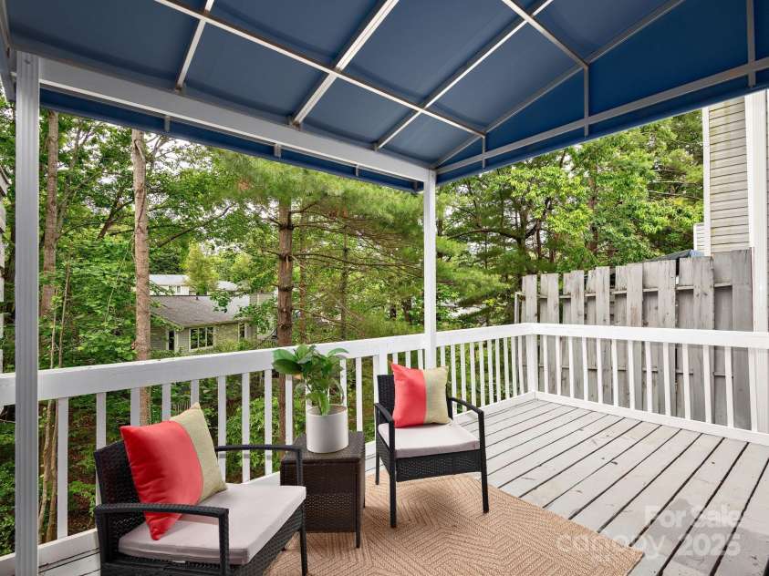 42 Hollybrook Drive, Asheville, NC 28803.  MLS# CAR4256176, YatesRealty ID 27329. Covered deck off main level to enjoy views of the surrounding trees