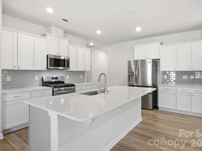 174 White Apple Way, Statesville, NC 28625.  MLS# CAR4383923, YatesRealty ID 27336. Chef's kitchen with a gas rnage
