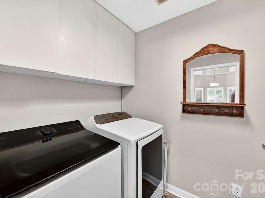 803 Water Wheel Court, Charlotte, NC 28209.  MLS# CAR4384715, YatesRealty ID 27337. Laundry Room conveniently located at the back of the kitchen and leads to door for 1 car garage.