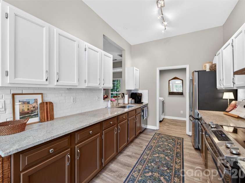 803 Water Wheel Court, Charlotte, NC 28209.  MLS# CAR4384715, YatesRealty ID 27337. Look at this Galley Kitchen with new granite counters and backsplash 