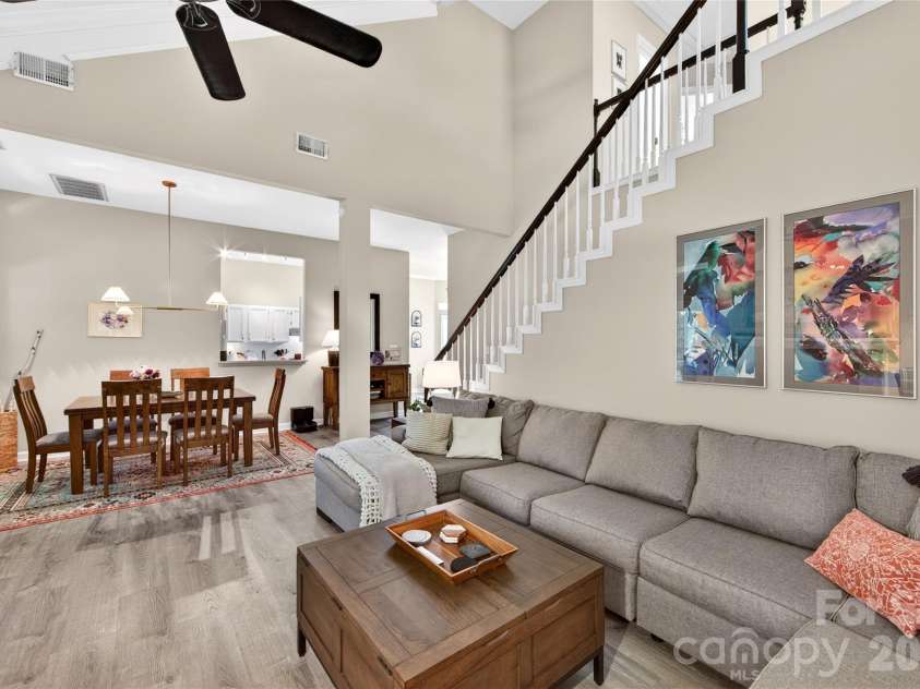 803 Water Wheel Court, Charlotte, NC 28209.  MLS# CAR4384715, YatesRealty ID 27337. The 2 story Family Room  is large includes a dining space and opens to a lovely screened porch