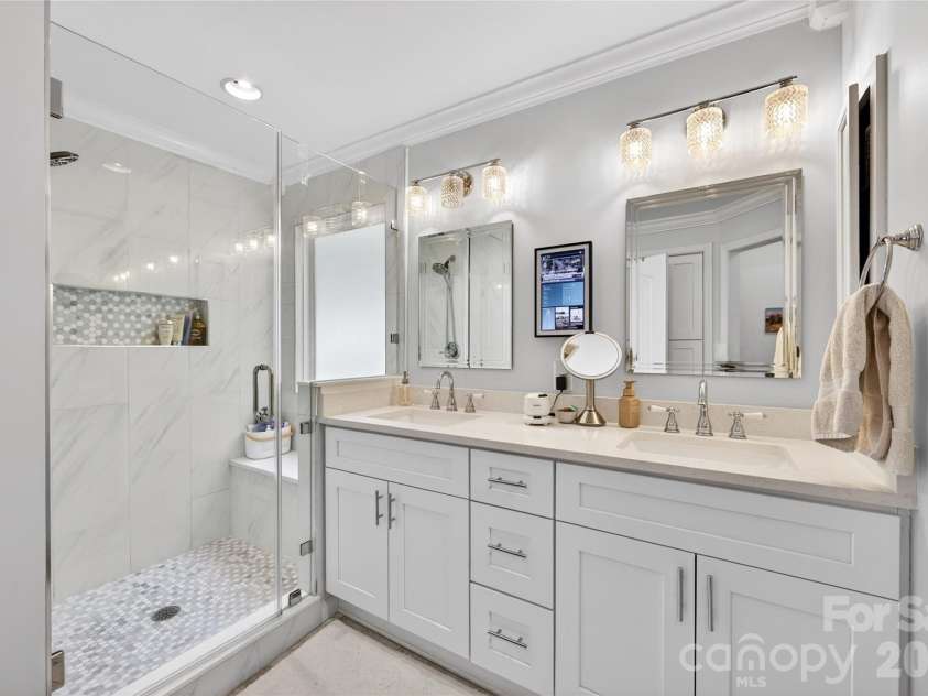 803 Water Wheel Court, Charlotte, NC 28209.  MLS# CAR4384715, YatesRealty ID 27337. Updated primary bath with double sinks , new cabinetry and you wiil love this shower with built in sitting bench