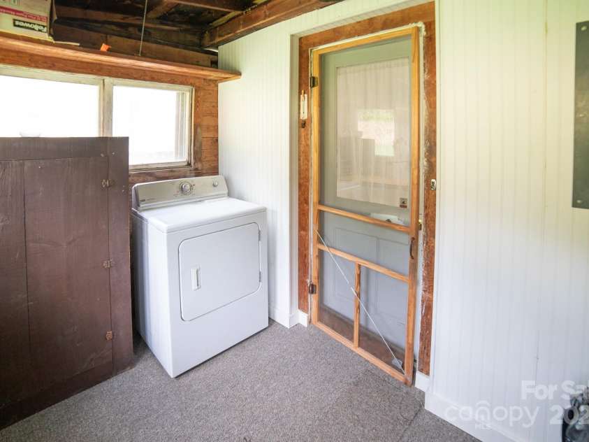 7610 Linville Falls Highway, Newland, NC 28657.  MLS# CAR4275283, YatesRealty ID 27338. Enclosed Back Porch/Dryer New carpet and white walls