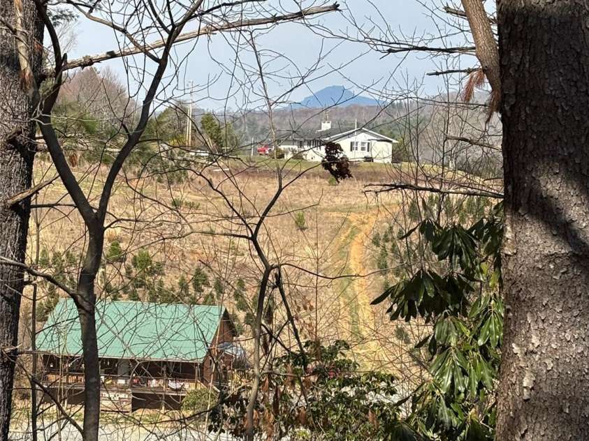 7610 Linville Falls Highway, Newland, NC 28657.  MLS# CAR4275283, YatesRealty ID 27338. View of Grandmother Mtn from top of hill