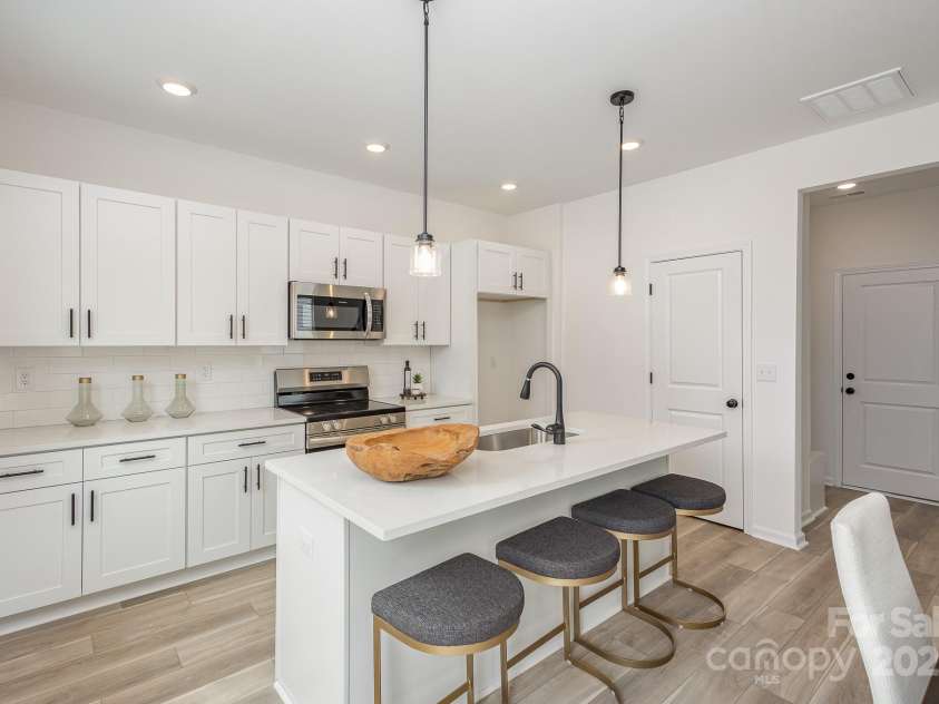 901 Cathey Road, Charlotte, NC 28214.  MLS# CAR4224939, YatesRealty ID 2734. Soft close cabinets. Representative Photo