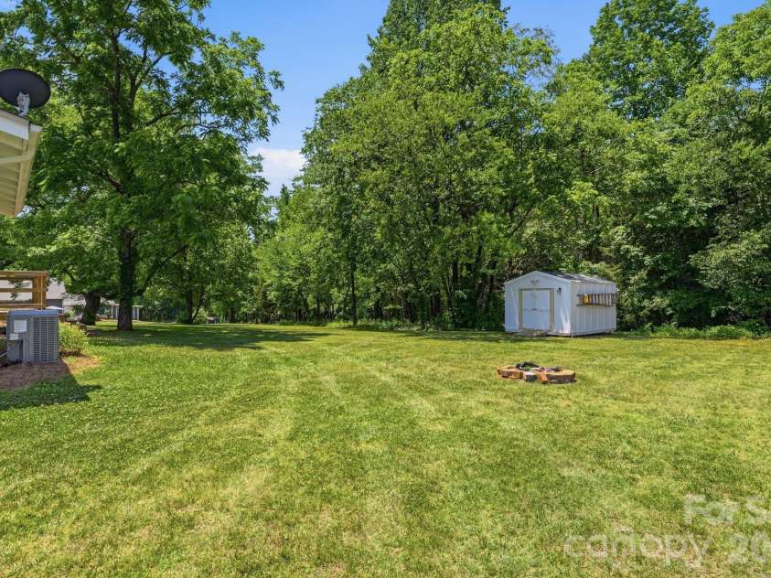 2850 Mathis Church Road, Catawba, NC 28609.  MLS# CAR4383912, YatesRealty ID 27340. Back Yard with Fire Pit and Outbuilding
