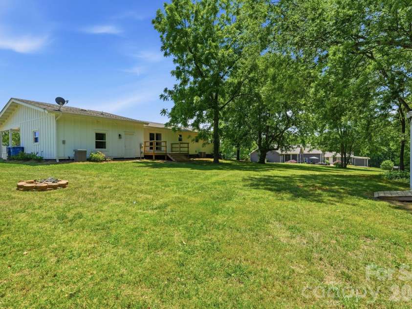 2850 Mathis Church Road, Catawba, NC 28609.  MLS# CAR4383912, YatesRealty ID 27340. Deck Overlooks Back Yard with Fire Pit