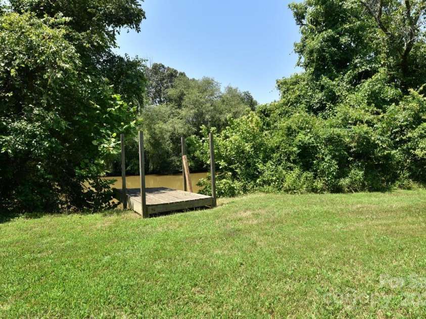 1924 Junction Road, Mocksville, NC 27028.  MLS# CAR4279453, YatesRealty ID 27346. Dock at River's edge