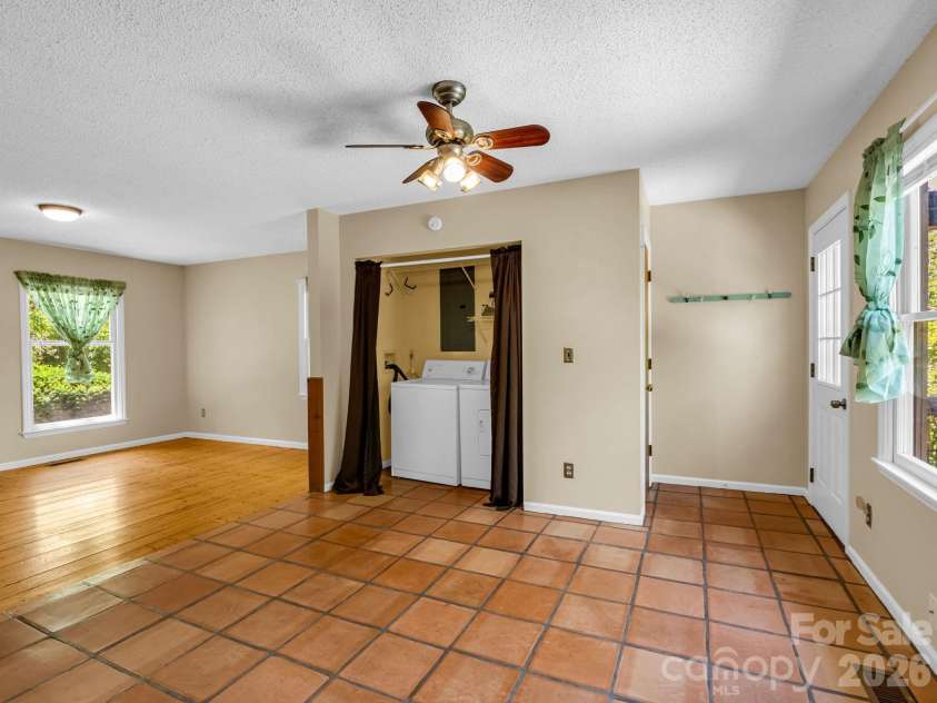255 & 257 Crescent Street, Saluda, NC 28773.  MLS# CAR4383610, YatesRealty ID 27346. Kitchen with Laundry Closet