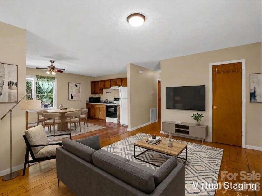 255 & 257 Crescent Street, Saluda, NC 28773.  MLS# CAR4383610, YatesRealty ID 27346. Living Room/Kitchen