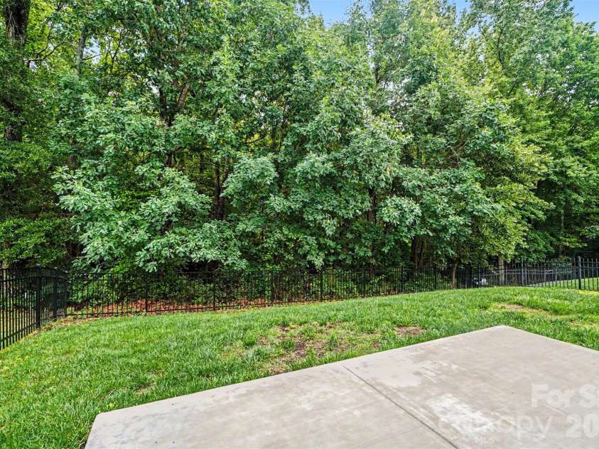 1145 Hammond Drive, Matthews, NC 28104.  MLS# CAR4386704, YatesRealty ID 27349. Backyard