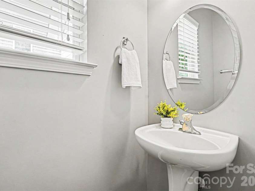 1145 Hammond Drive, Matthews, NC 28104.  MLS# CAR4386704, YatesRealty ID 27349. First floor half bathroom