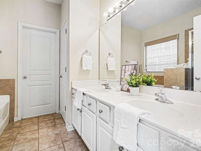 1145 Hammond Drive, Matthews, NC 28104.  MLS# CAR4386704, YatesRealty ID 27349. Primary bathroom
