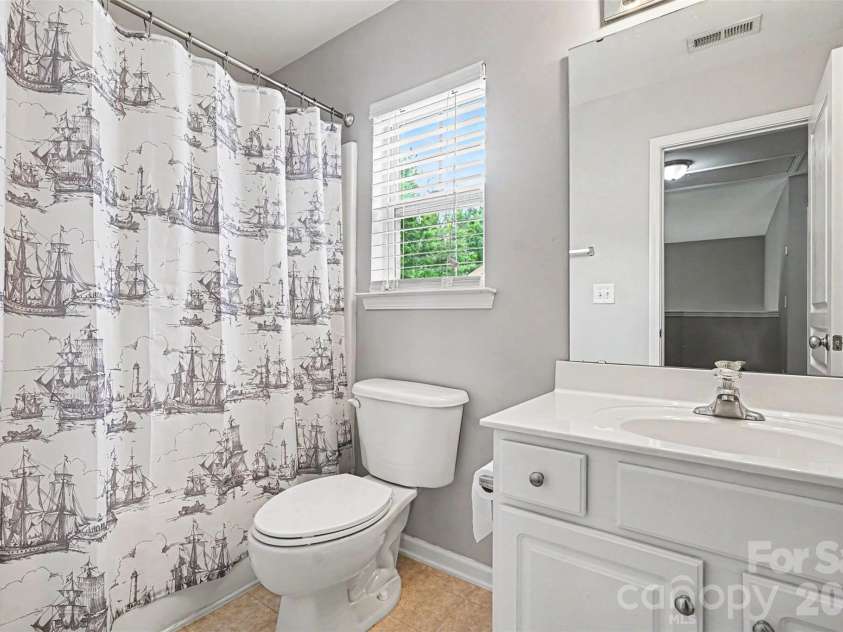 1145 Hammond Drive, Matthews, NC 28104.  MLS# CAR4386704, YatesRealty ID 27349. Second floor full bath