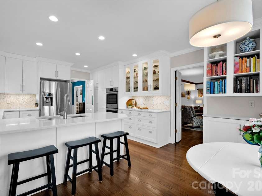 421 Sardis Lane, Charlotte, NC 28270.  MLS# CAR4363122, YatesRealty ID 27355. Full pull out pantries next to ovens, storage galore!