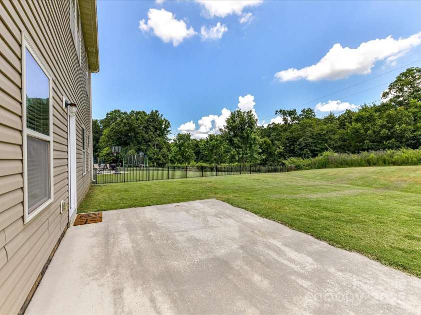 2420 Sierra Chase Drive, Monroe, NC 28112.  MLS# CAR4281740, YatesRealty ID 27356. Back patio