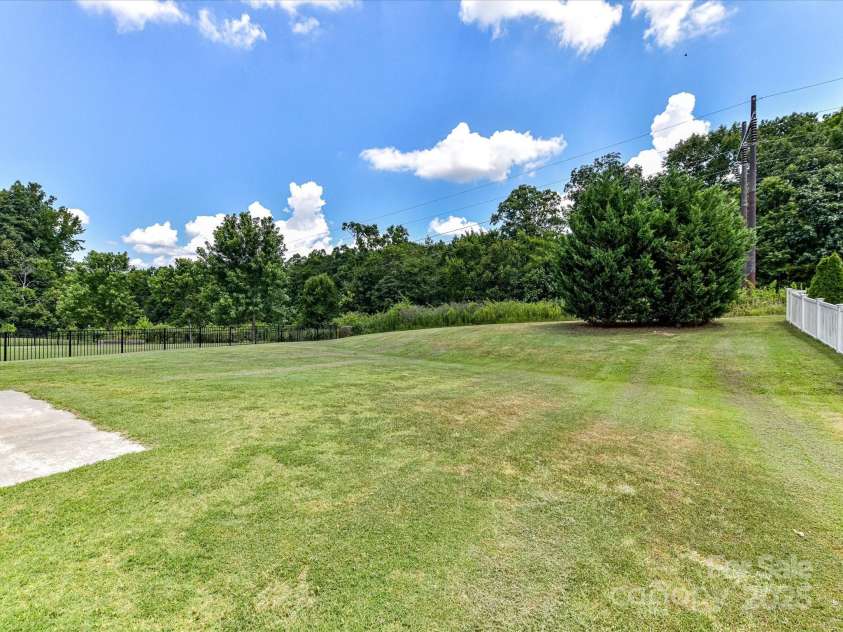 2420 Sierra Chase Drive, Monroe, NC 28112.  MLS# CAR4281740, YatesRealty ID 27356. Nice flat backyard that backs to HOA common area