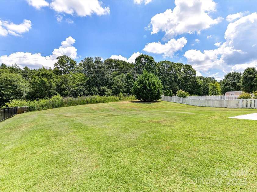 2420 Sierra Chase Drive, Monroe, NC 28112.  MLS# CAR4281740, YatesRealty ID 27356. Nice flat backyard that backs to HOA common area