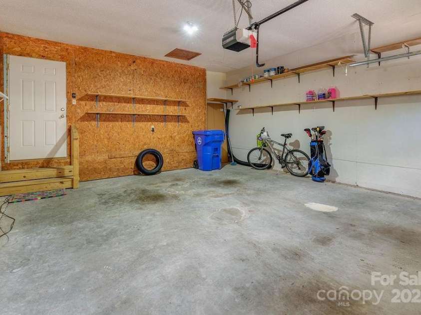 100 Thistle Knoll Court, Asheville, NC 28803.  MLS# CAR4278085, YatesRealty ID 27367. 2 car garage with brand new garage door! Hardwired Generator is a huge bonus!