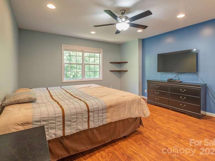 100 Thistle Knoll Court, Asheville, NC 28803.  MLS# CAR4278085, YatesRealty ID 27367. A view of greenery awaits