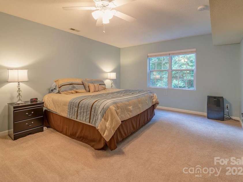 100 Thistle Knoll Court, Asheville, NC 28803.  MLS# CAR4278085, YatesRealty ID 27367. Basement bedroom 1 - generously sized and still gets great light!