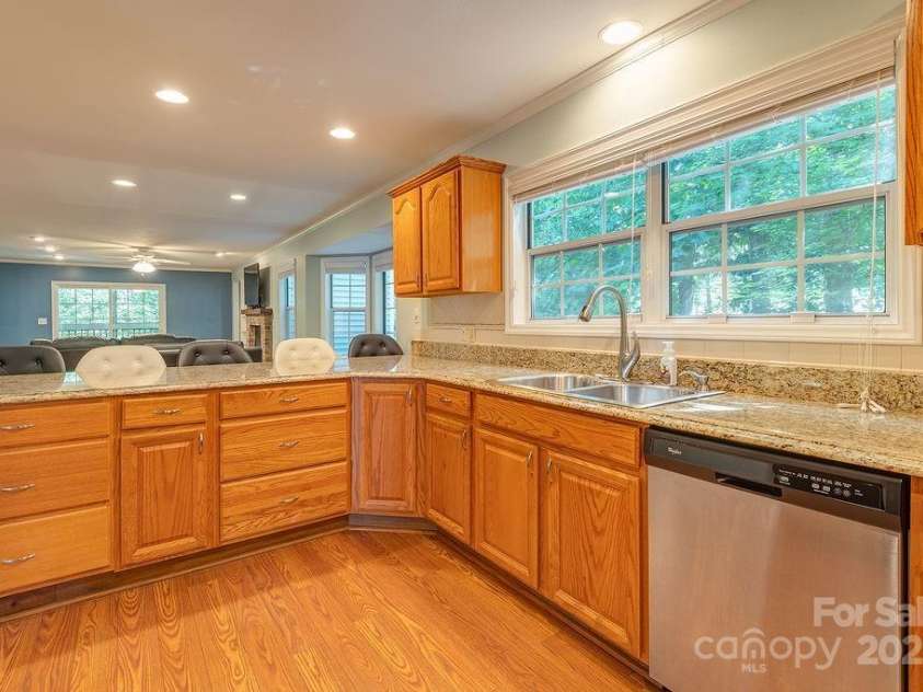 100 Thistle Knoll Court, Asheville, NC 28803.  MLS# CAR4278085, YatesRealty ID 27367. Extended countertop in kitchen - great for hosting
