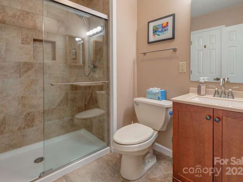 100 Thistle Knoll Court, Asheville, NC 28803.  MLS# CAR4278085, YatesRealty ID 27367. Main level guest bath - completely renovated