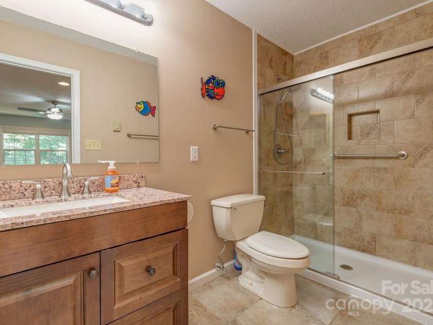 100 Thistle Knoll Court, Asheville, NC 28803.  MLS# CAR4278085, YatesRealty ID 27367. Newly renovated tiled bathroom