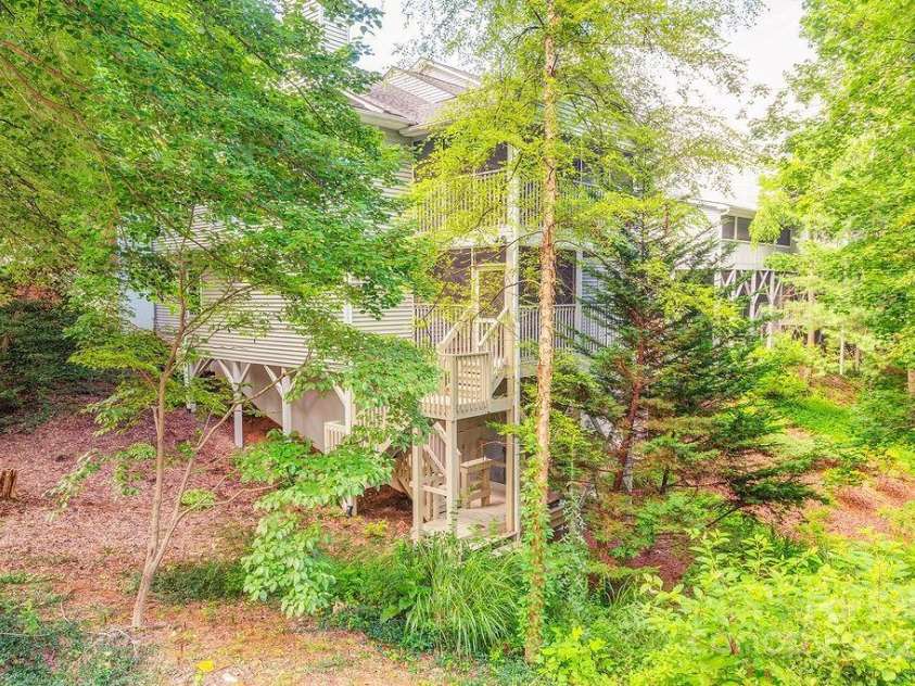 100 Thistle Knoll Court, Asheville, NC 28803.  MLS# CAR4278085, YatesRealty ID 27367. Side/rear View!