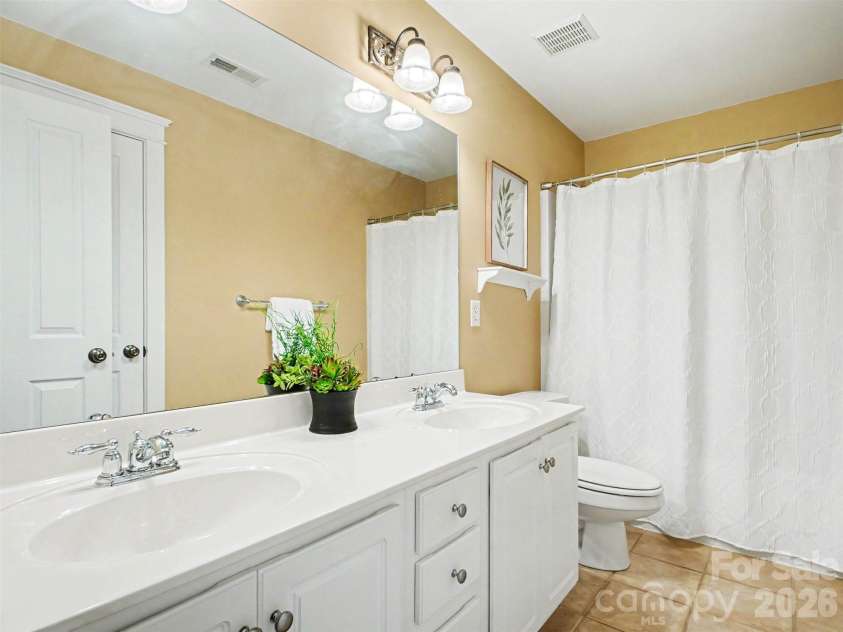 1311 Dobson Drive, Waxhaw, NC 28173.  MLS# CAR4377774, YatesRealty ID 27369. Hall bathroom upstairs